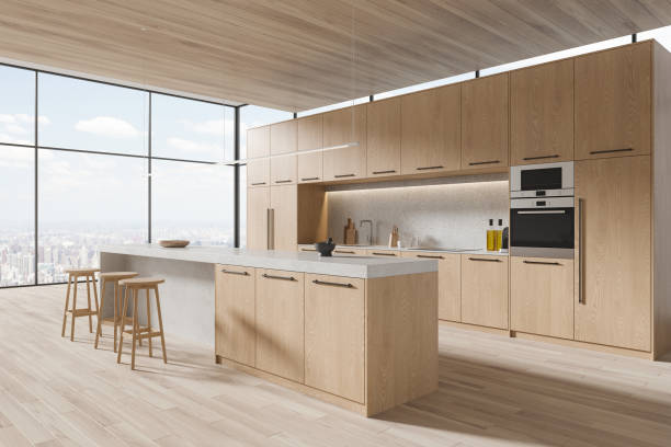 istock Wooden home kitchen interior with bar counter, cooking cabinet and window 1879503821