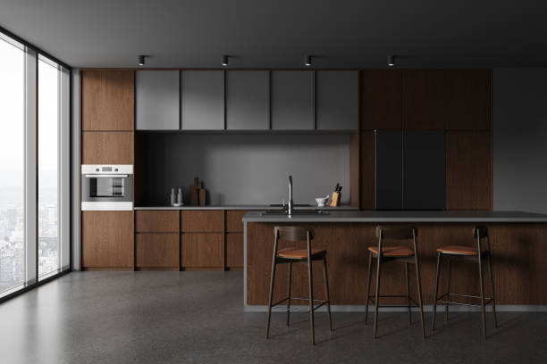 istock Grey home kitchen interior bar counter and cooking area, panoramic window 1879506469