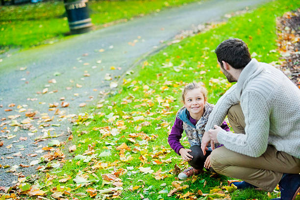 istock Father and daughter having fun in a London`s park 187951316
