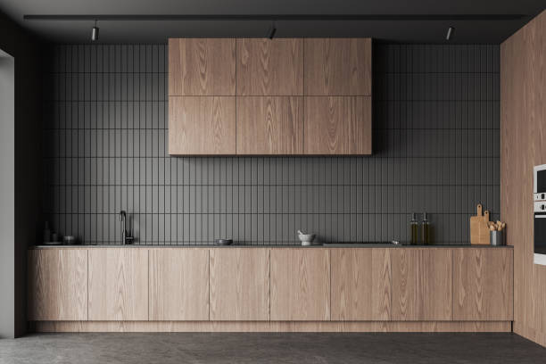 istock Dark wooden kitchen interior with cabinet and kitchenware, cooking space 1879513711