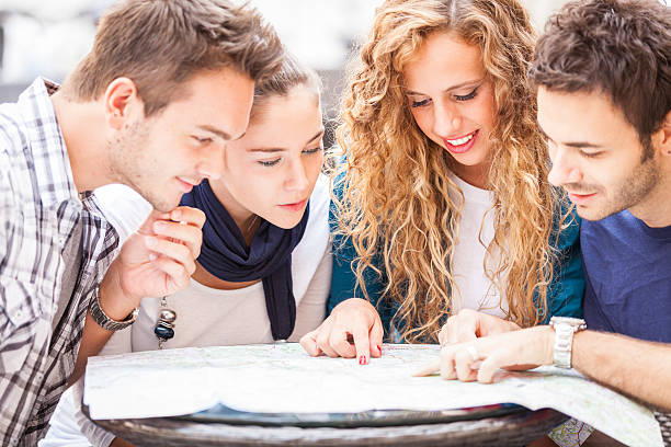istock A group of tourists looking at a map together 187952132