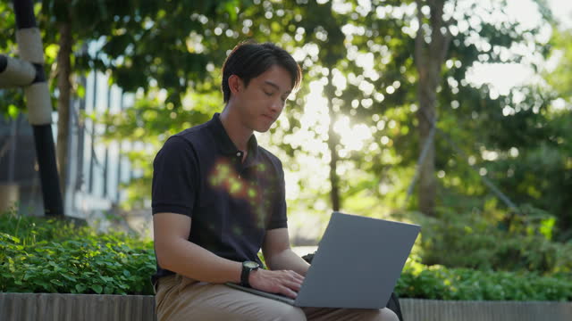 Man Expresses Stress on Laptop at a Serene Park Bench.