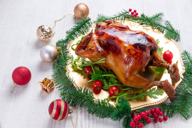 istock Roasted whole chicken with Christmas decoration. 1879554538
