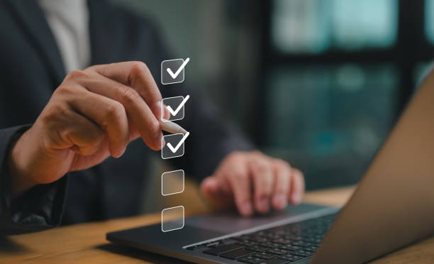 istock Business performance checklist, businessman using laptop doing online checklist survey, filling out digital form checklist, take an assessment, questionnaire, evaluation, online survey, online exam. 1879559186