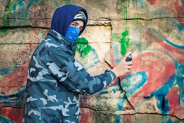 istock Teenager with color spray can 187955984