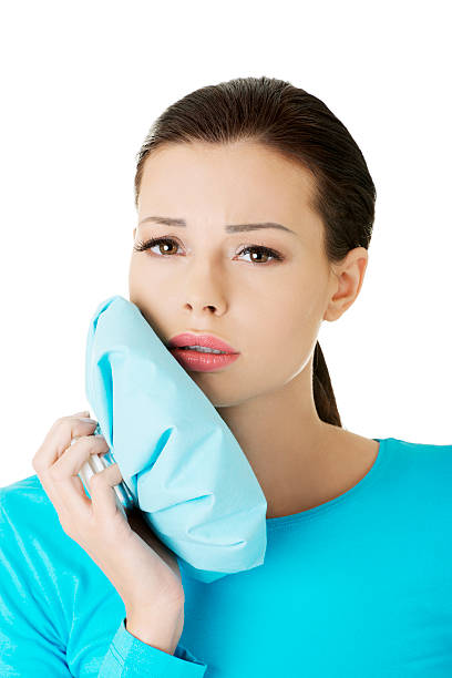 istock Casual woman holding ice bag, having toothache. 187956100