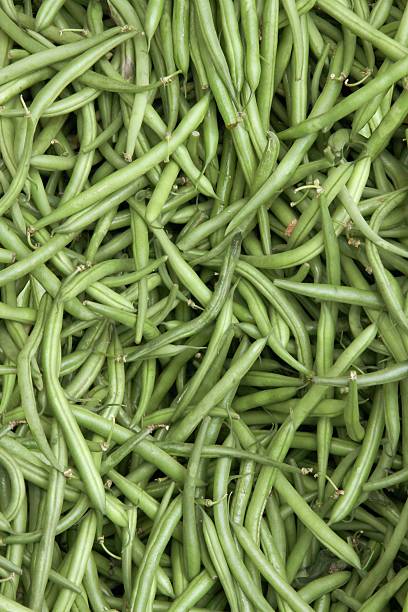 green husks on string bean vegetable stock photo