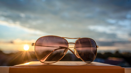 Glasses on a books in the sunset. Relaxing concept.