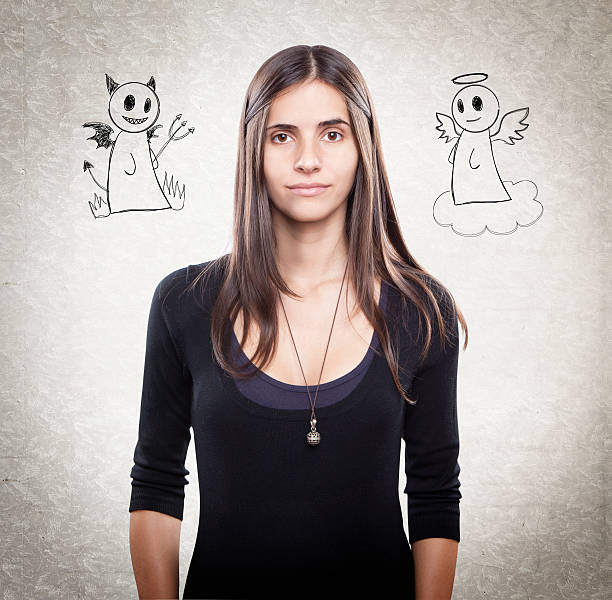 istock Young woman with angel and devil 187957460