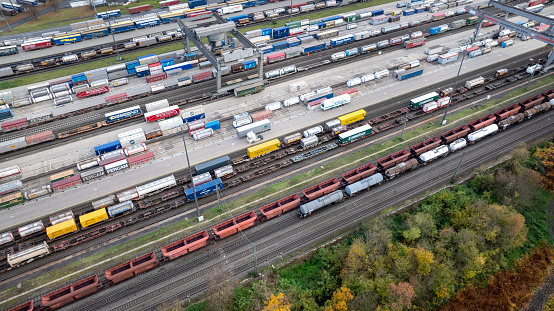 Huerth, Germany - November 22, 2023: Railyard, freight station and freight trains at Koeln - Eifeltor. Aerial view