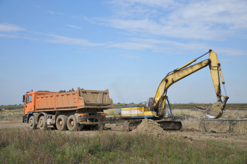 Loading Backhoe Backhoe Loading A Dump Truck Stock Photo - Download Image Now ...