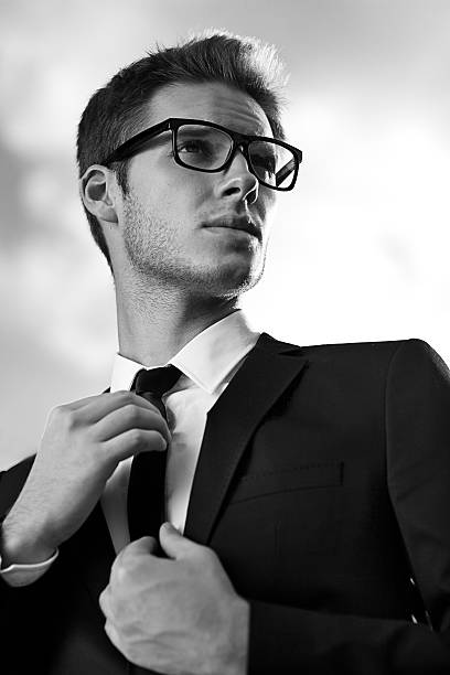 istock handsome young businessman with glasses black and white 187962671