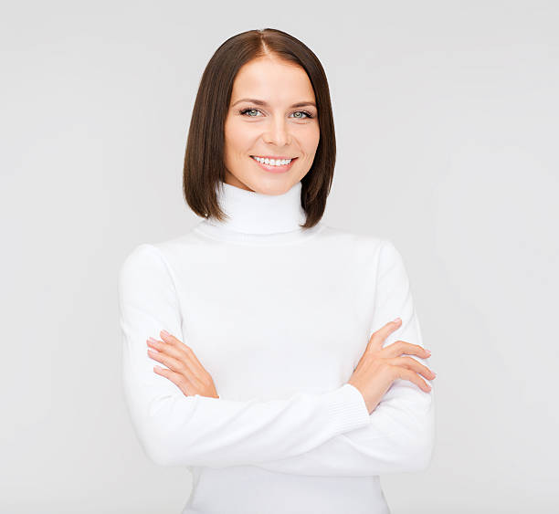 istock smiling woman in white sweater 187962872