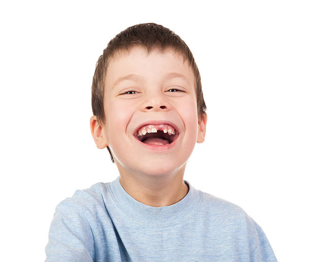 istock Boy portrait with a lost tooth 187963222