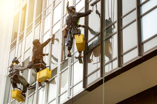 istock Industrial mountaineering workers hangs over residential facade building 1879635109