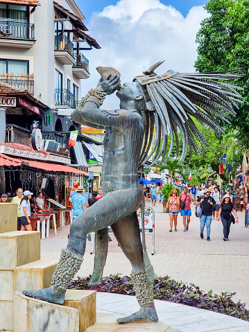 Mexico, Playa del Carmen, December 17, 2023, statue of a Mayan warrior playing a conch shell