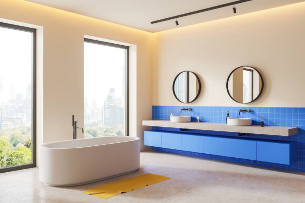 istock Luxury hotel bathroom interior with double sink and tub, panoramic window 1879644567