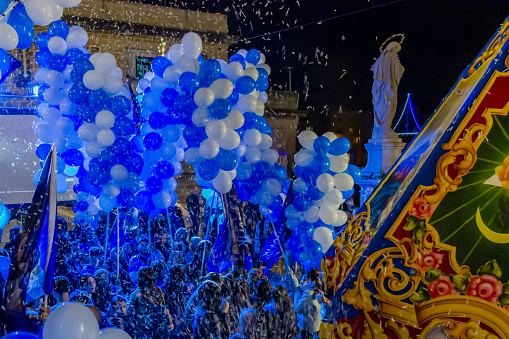 COSPICUA  MALTA - December 06, 2023: Balloons and flags at the Maltese village feast of Immaculate Conception at Cospicua