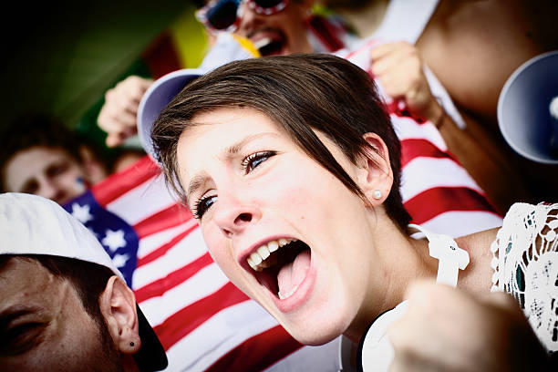 istock Sports fans cheering a game 187971681
