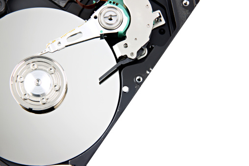 Open The Harddisk and focus picture in Disk storage on white background.