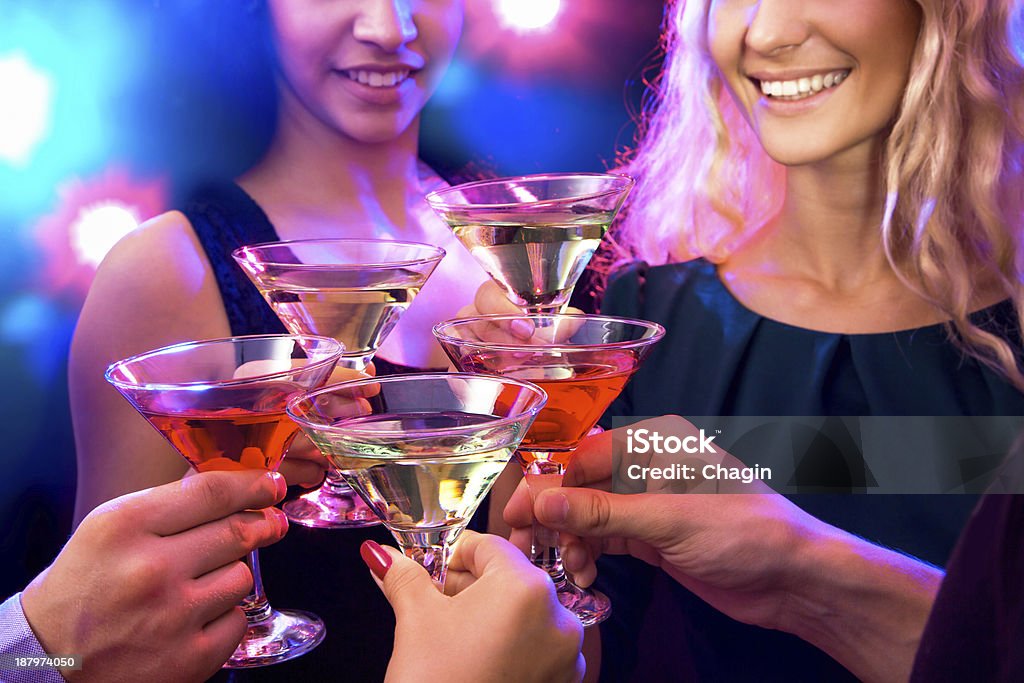 Happy people Happy people clinking by glasses with each other Cocktail Stock Photo
