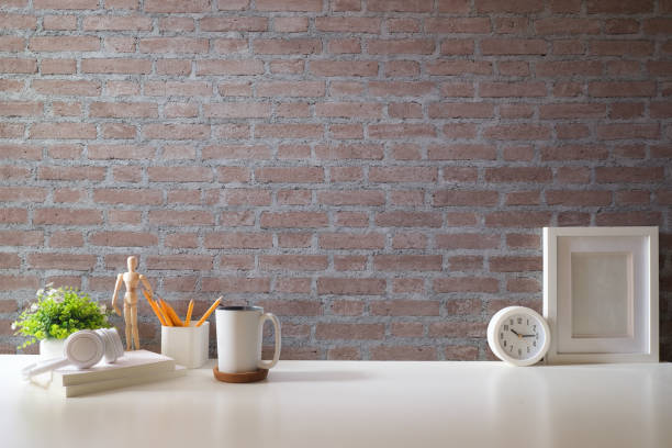 istock Comfortable workplace with coffee, stationery and houseplant on white table. Home office, copy space. 1879748212