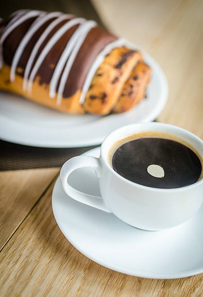 istock Chocolate bun with cup of coffee 187975042