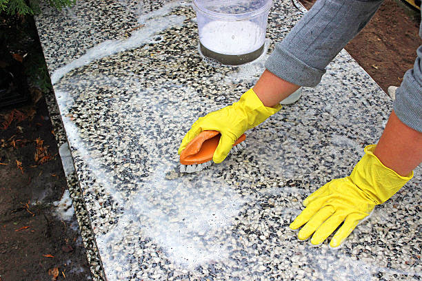 cleaning of the monument at cemetery stock photo