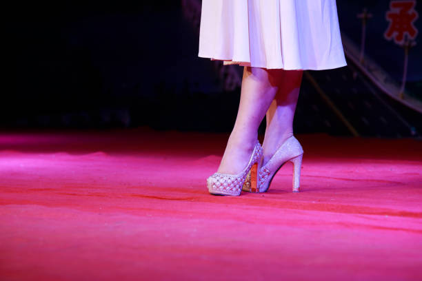 istock Beautiful legs and high heels on stage 1879755551