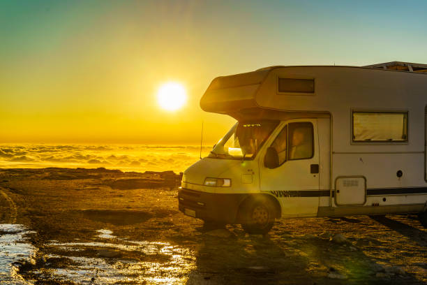 istock Rv camper in mountains above clouds at sunrise 1879757618