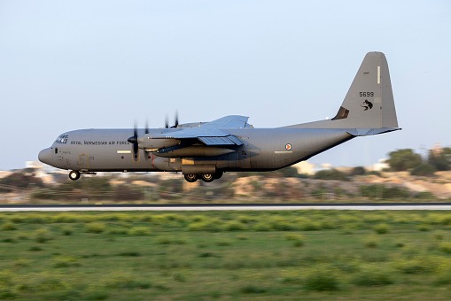 Luqa, Malta - December 13, 2023: Norwegian Air Force Lockheed Martin C-130J-30 Hercules (Reg: 5699) landing for a technical stop in the late evening for the 2nd time in a few days.