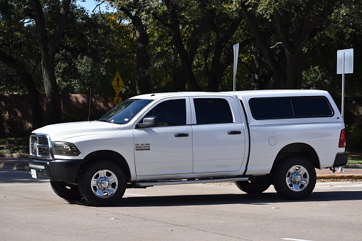 Houston, TX USA 12-19-2023 - A classic white Ram 2500 pick-up truck cruising near Herman Park in Houston