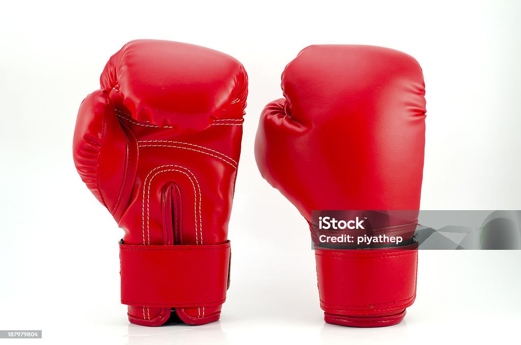 Red boxing gloves on grey background Red boxing gloves isolated on white Boxing Glove Stock Photo
