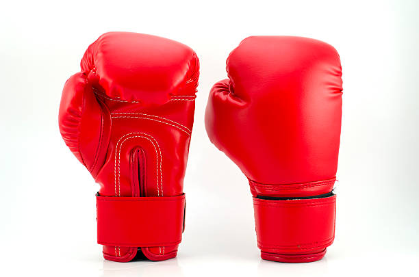 red boxing gloves on grey background - 拳套 個照片及圖片檔
