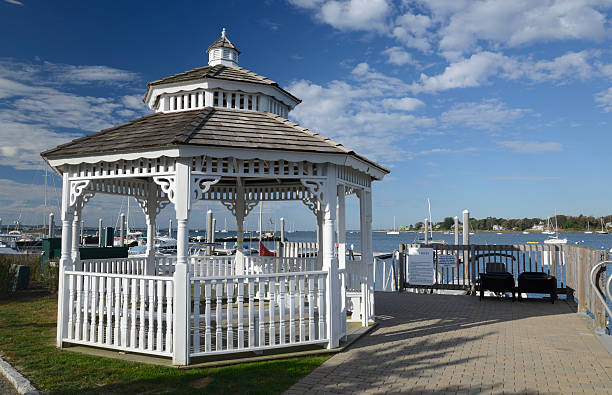 istock white gazebo by a harbor in the early morning 187979968