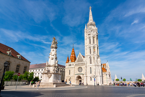 Budapest, Hungary - April 2019: Matthias Church in Fisherman Bastion and Holy Trinity column