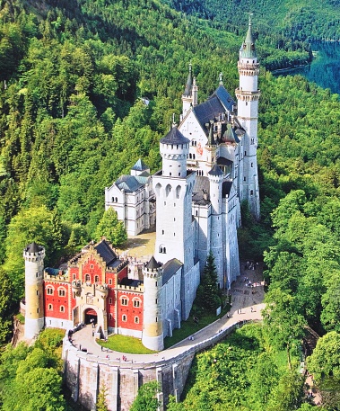 Beautiful view of most world-famous Neuschwanstein Castle, the nineteenth-century Romanesque Revival palace built for King Ludwig II on a rugged cliff near Fussen, southwest Bavaria, Germany