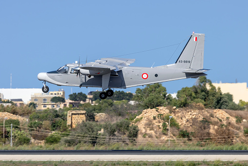 Luqa, Malta - September 24, 2023: Maltese Armed Forces Pilatus Britten-Norman BN-2T Turbine Islander (REG: AS9819) landing in bright sunshine.