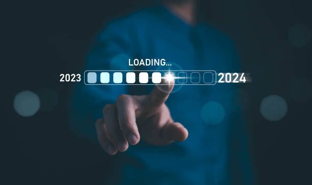 istock Businessman touch on loading progress from 2023 to 2024,Planning and challenge strategy in new year 2024 Concept. New business startup in 2024. New year 2024 is loading, calendar date, end of the year 1879832706