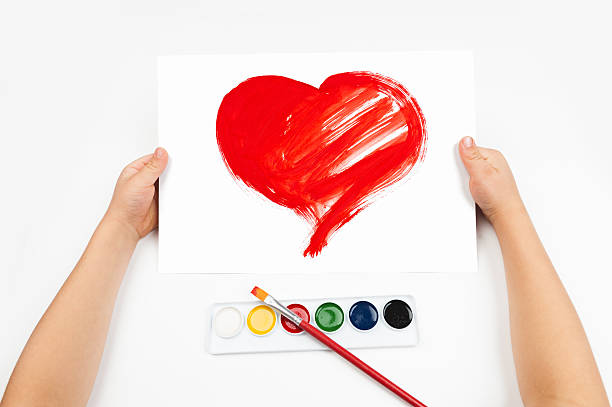 istock Child draws the heart watercolors 187983358