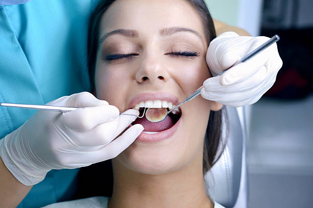 istock Young Woman at the Dentist 187986347