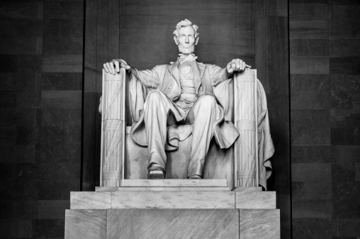 A monochrome image of the statue in the Abraham Lincoln Memorial in Washington, DC.