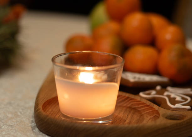 istock Christmas composition with candle and tangerines 1879879850