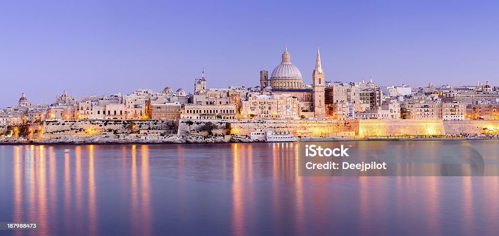 St Pauls Anglican Cathedral and Carmelite Church at Valletta Malta The harbour and St. Paul's Anglican Cathedral and Carmelite Church at Valetta, Malta at twilight. Malta Stock Photo
