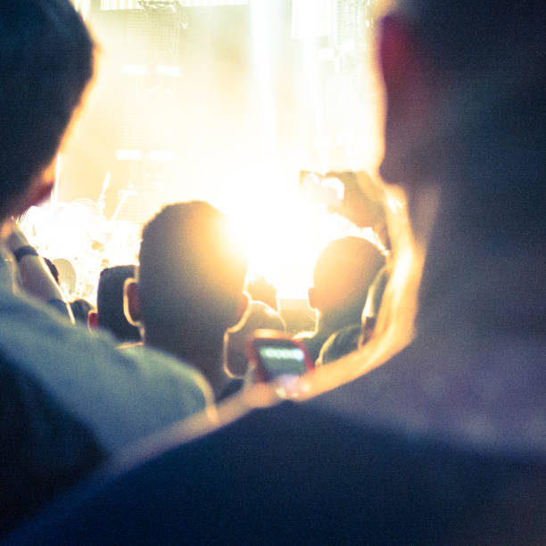 istock Crowd taking picture with mobile phone at music concert 187990116