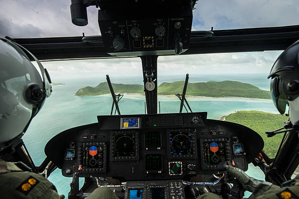 istock Helicopter pilot seen from behind above the island, Thailand 187990217