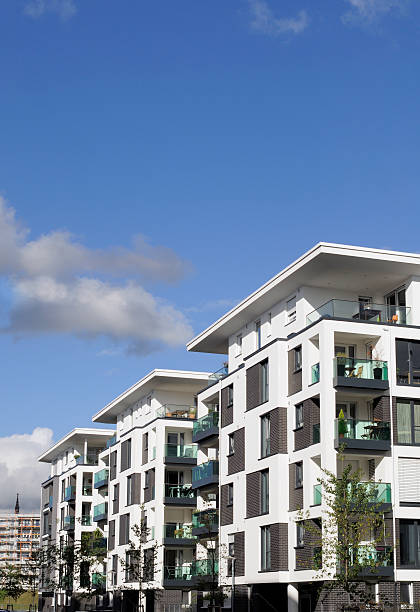 istock White apartment houses and clear sky 187991570