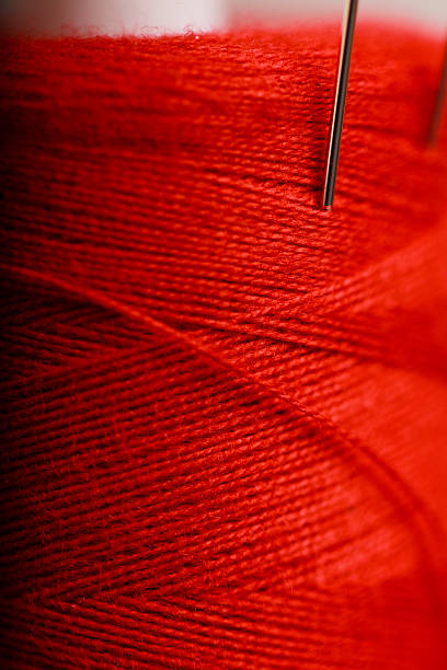 Red Thread and Needle stock photo