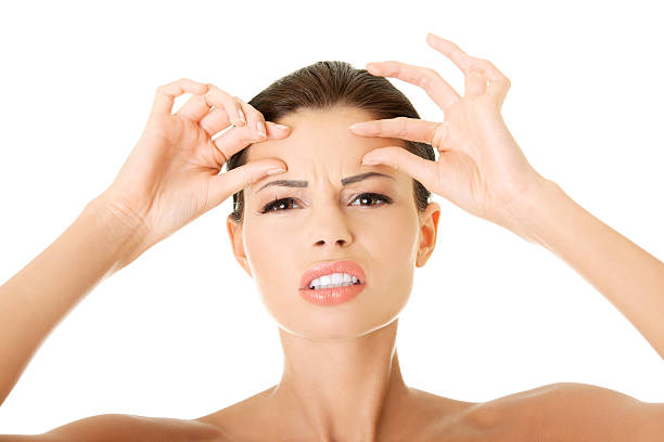 istock Young woman checking her wrinkles. 187992693