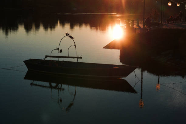 Free picture: Sunset over a lake harbor with silhouettes of small motor ...
